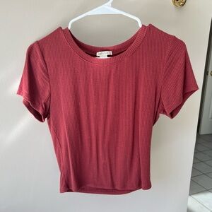 A rose colored shirt size medium